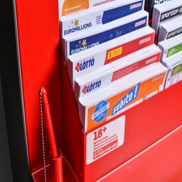Game tickets in the game ticket rack at a kiosk.